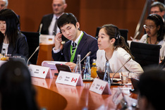 Young people from G7 states get actively involved in discussions during their meeting with Chancellor Angela Merkel at the Federal Chancellery.