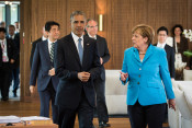 Chancellor Angela Merkel and President Barack Obama on their way to the first working session of the G7