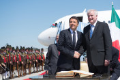 Italian Prime Minister Matteo Renzi is greeted by Bavarian Minister-President Horst Seehofer at Munich airport on 7 June 2015