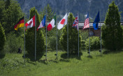 The flags of the G7 nations (Germany, Canada, France, Italy, Japan, the UK and the USA) in front of Schloss Elmau next to the flag of the European Union