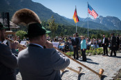 US President Barack Obama and German Chancellor Angela Merkel are greeted by alphorn players on their visit to Krün on 7 June 2015
