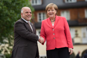 Chancellor Angela Merkel welcomes Iraq's Prime Minister, Haider al-Abadi, in front of Schloss Elmau