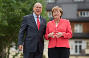 Chancellor Angela Merkel welcomes the Secretary-General of the Organisation for Economic Co-operation and Development (OECD), Angel Gurría, in front of Schloss Elmau