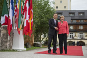 Federal Chancellor Angela Merkel greets UN Secretary-General Ban Ki-moon in front of Schloss Elmau
