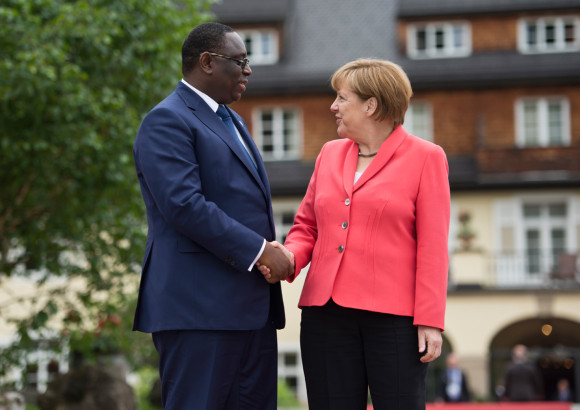 Federal Chancellor Angela Merkel greets Senegal’s President Macky Sall in front of Schloss Elmau