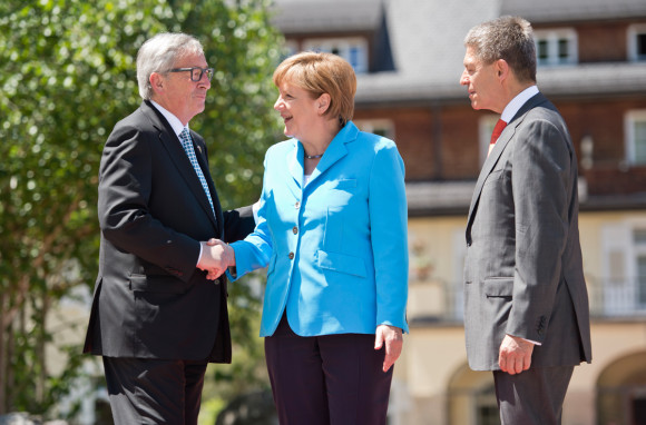 German Chancellor Angela Merkel and her husband Joachim Sauer (right) welcome the President of the European Commission, Jean-Claude Juncker, in front of Schloss Elmau
