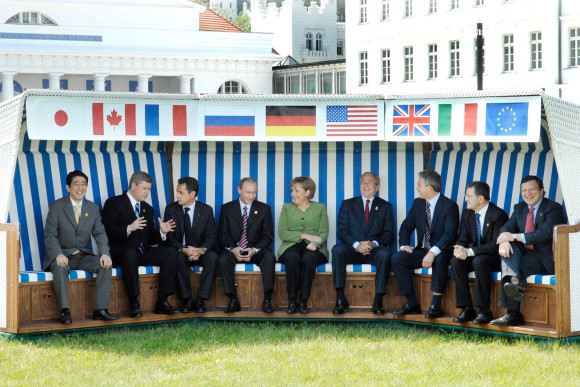 Group photo in a roofed wicker beach chair
